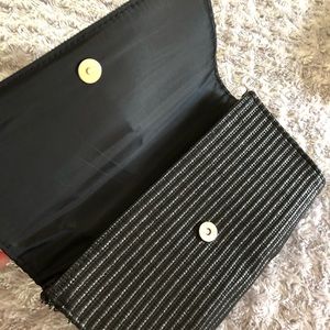 Black fabric weave H&M clutch. Like new.